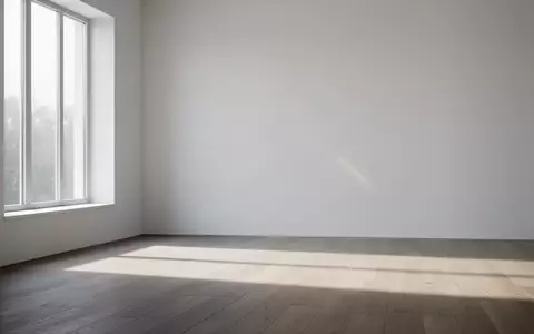 Ein minimalistischer, leerer Raum mit natürlichem Lichteinfall und sanften Schatten auf einem Holzboden. - Foto: über boerse-global.de