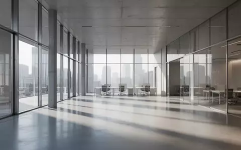 Ein minimalistischer, leerer Büro- und Konferenzraum in einem modernen Finanzgebäude mit großen Glasfronten und klaren Strukturen. - Foto: über boerse-global.de
