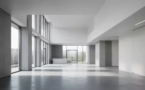 Modernes, minimalistisches Bürogebäude mit klaren architektonischen Linien und natürlichem Lichteinfall. - Foto: über boerse-global.de
