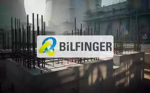 Moderne industrielle Baustelle eines Kernkraftwerks mit Stahlarmierungen und Betonstrukturen in atmosphärischem Licht. - Foto: über boerse-global.de