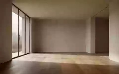 Minimalistischer, leerer Innenraum mit natürlichem Licht und Holzboden in einer modernen Architektur. - Foto: über boerse-global.de