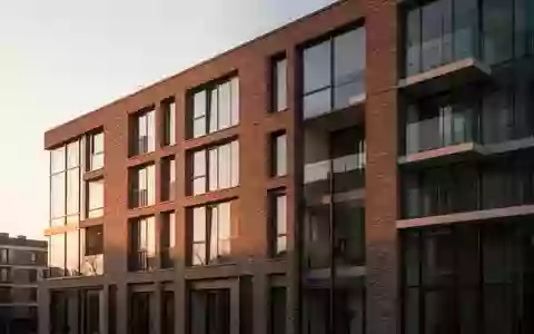Moderne Fassade eines Wohngebäudes bei Sonnenuntergang als Symbol für den Immobilienmarkt. - Foto: über boerse-global.de