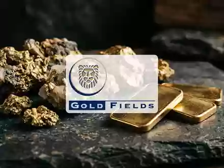 Goldbarren und Golderz auf einem dunklen Steinhintergrund als Symbol für den Edelmetallmarkt. - Foto: über boerse-global.de