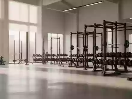 Ein minimalistisches, modernes Fitnessstudio mit Hantelbanken und Gewichten in einer ruhigen, hellen Umgebung. - Foto: über boerse-global.de