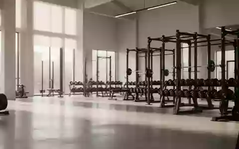 Ein minimalistisches, modernes Fitnessstudio mit Hantelbanken und Gewichten in einer ruhigen, hellen Umgebung. - Foto: über boerse-global.de