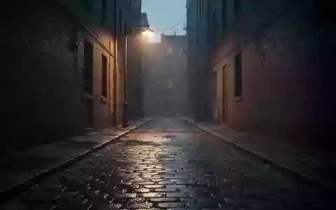 Eine leere, nächtliche Gasse in einer Stadt mit Kopfsteinpflaster und gedämpfter Straßenbeleuchtung. - Foto: über boerse-global.de