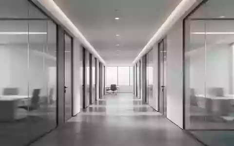Ein minimalistischer, moderner Büroflur mit klaren architektonischen Linien und indirekter Beleuchtung. - Foto: über boerse-global.de