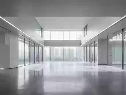 Ein minimalistisches, modernes Interieur eines Forschungszentrums mit poliertem Betonboden und hellem Tageslicht. - Foto: über boerse-global.de