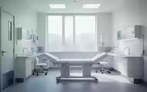 Ein heller, steriler Behandlungsraum in einem Krankenhaus mit ruhigem Lichteinfall und moderner Architektur. - Foto: über boerse-global.de