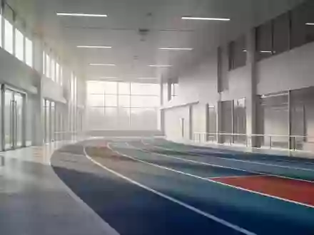 Ein minimalistischer, heller Innenraum einer Sportanlage mit einer Laufbahn bei Tageslicht. - Foto: über boerse-global.de