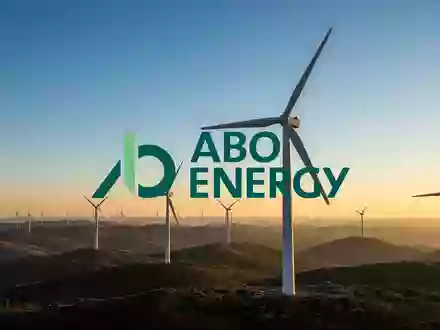 Moderne Windkraftanlagen in einer weiten Landschaft bei Sonnenuntergang als Symbol für erneuerbare Energien. - Foto: über boerse-global.de