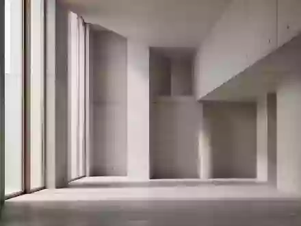 Ein minimalistischer, moderner Innenraum mit klaren geometrischen Linien und natürlichem Lichteinfall. - Foto: über boerse-global.de