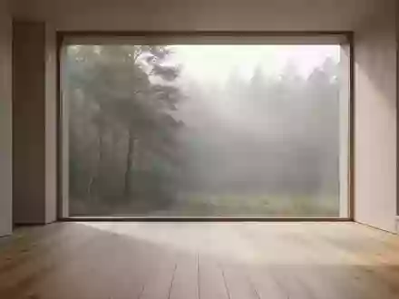 Ein heller, minimalistischer Raum mit Blick in einen nebligen Wald, der Ruhe und Gelassenheit ausstrahlt. - Foto: über boerse-global.de