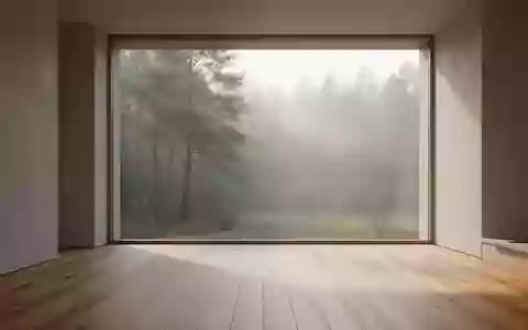 Ein heller, minimalistischer Raum mit Blick in einen nebligen Wald, der Ruhe und Gelassenheit ausstrahlt. - Foto: über boerse-global.de