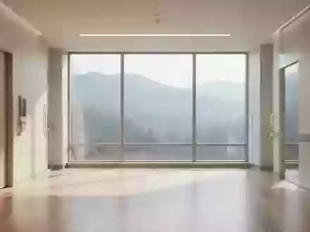 Heller, moderner Innenraum einer Fachklinik mit minimalistischer Architektur und Blick auf eine ruhige Berglandschaft. - Foto: über boerse-global.de