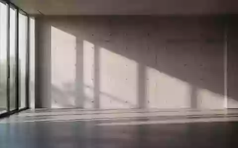 Minimalistischer Innenraum mit architektonischen Schattenwürfen an einer Betonwand. - Foto: über boerse-global.de