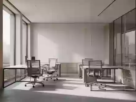 Ein minimalistischer, lichtdurchfluteter Arbeitsbereich mit modernen architektonischen Linien und neutralen Oberflächen. - Foto: über boerse-global.de