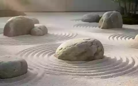 Minimalistischer Zen-Garten mit geharktem Sand und glatten Flusskieselsteinen in sanftem Morgenlicht. - Foto: über boerse-global.de