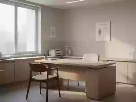 Ein heller, minimalistischer Behandlungsraum in einer Klinik mit einem leeren Schreibtisch und sanftem Tageslicht. - Foto: über boerse-global.de