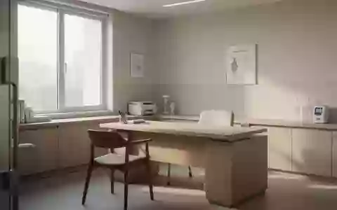 Ein heller, minimalistischer Behandlungsraum in einer Klinik mit einem leeren Schreibtisch und sanftem Tageslicht. - Foto: über boerse-global.de
