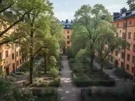 Ein urbanes Wohnviertel mit viel Vegetation und Bäumen zwischen den Häuserblöcken bei Tageslicht. - Foto: über boerse-global.de