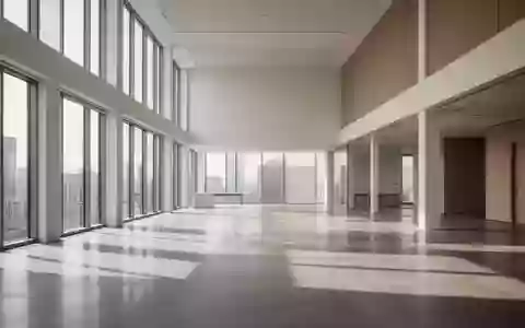 Modernes, minimalistisches Büro-Interieur mit hohen Decken und großen Fenstern in einer hellen, offenen Architektur. - Foto: über boerse-global.de
