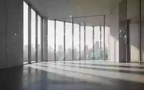 Ein minimalistischer, moderner Innenraum mit hellem Tageslicht und langen Schatten auf einem Betonboden. - Foto: über boerse-global.de