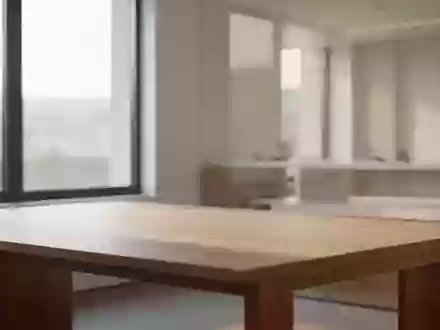 Ein minimalistischer, leerer Arbeitsplatz mit hellem Holzschreibtisch und natürlichem Lichteinfall in einem modernen Raum. - Foto: über boerse-global.de