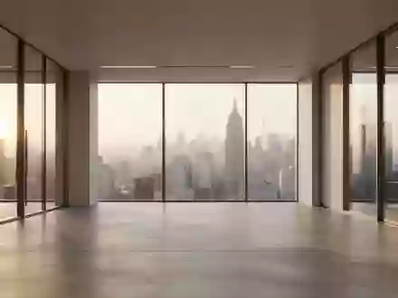 Minimalistische, moderne Büroarchitektur mit großen Glasfronten und einfallendem Tageslicht. - Foto: über boerse-global.de