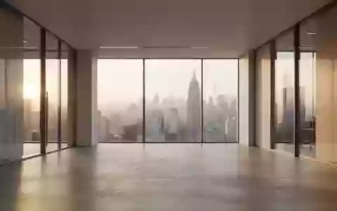 Minimalistische, moderne Büroarchitektur mit großen Glasfronten und einfallendem Tageslicht. - Foto: über boerse-global.de