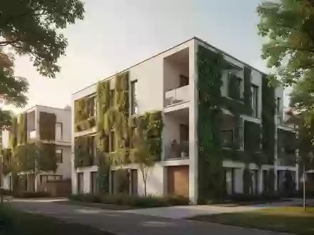 Moderne Wohngebäude mit Fassadenbegrünung in einer ruhigen Wohngegend - Foto: über boerse-global.de