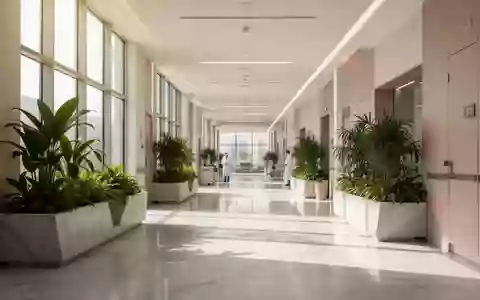 Ein moderner, lichtdurchfluteter Flur in einem Krankenhaus in Abu Dhabi mit minimalistischer Architektur und Pflanzen. - Foto: über boerse-global.de