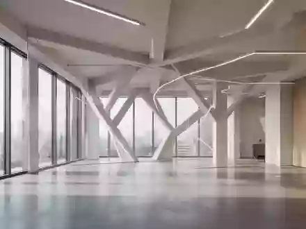Ein minimalistisch gestalteter, leerer Büroinnenraum mit klaren architektonischen Linien und natürlichem Lichteinfall. - Foto: über boerse-global.de