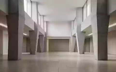 Minimalistische, moderne Architektur mit geometrischen Betonpfeilern und diffusem Tageslicht in einem leeren Raum. - Foto: über boerse-global.de