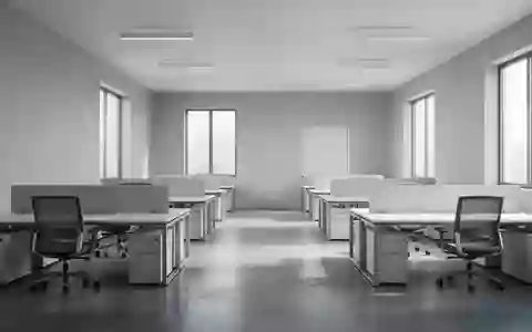 Ein minimalistisch gestalteter, heller Büroraum mit leeren Schreibtischen und natürlichem Tageslicht. - Foto: über boerse-global.de