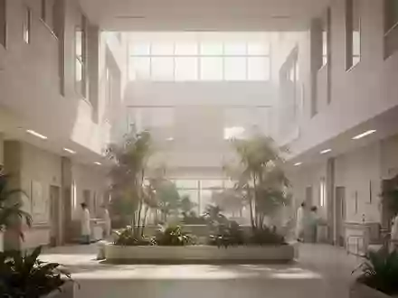 Ein helles, modernes Krankenhausatrium mit minimalistischer Architektur und Pflanzen, das eine beruhigende Atmosphäre ausstrahlt. - Foto: über boerse-global.de