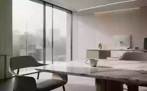 Ein minimalistischer Arbeitsbereich mit einem leeren Tisch und sanftem Tageslicht durch ein großes Fenster. - Foto: über boerse-global.de