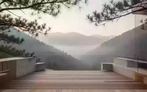 Eine ruhige, minimalistische Holzterrasse mit Blick auf ein nebliges Gebirgstal im sanften Morgenlicht. - Foto: über boerse-global.de