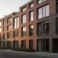 Moderne Wohnhausfassade in Hamburg bei spätem Nachmittagslicht. - Foto: über boerse-global.de