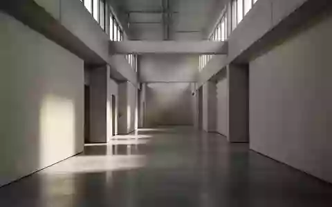 Ein leerer, minimalistischer Flur in einem modernen Gebäude mit klaren architektonischen Linien und neutralen Oberflächen. - Foto: über boerse-global.de