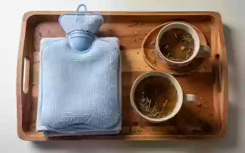 Symbolbild: Wärmflasche, Handtuch und Kräutertee - Foto: über boerse-global.de