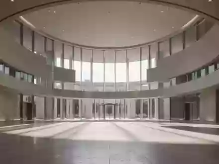 Ein minimalistischer, moderner Innenraum eines Regierungsgebäudes mit großen Glasfenstern und klaren Linien. - Foto: über boerse-global.de