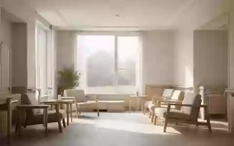Ein heller, modern gestalteter Wohnraum mit warmem Tageslicht und minimalistischer Einrichtung für die häusliche Pflege. - Foto: über boerse-global.de