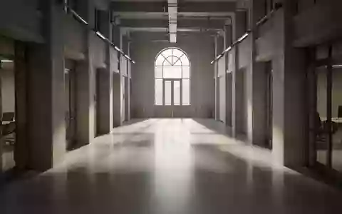 Ein leerer, minimalistischer Büroflur in einem Regierungsgebäude mit langen Schatten und einfallendem Tageslicht. - Foto: über boerse-global.de