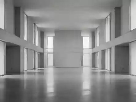 Minimalistischer, moderner Innenraum mit klaren architektonischen Linien und natürlichem Licht, der eine institutionelle Atmosphäre vermittelt. - Foto: über boerse-global.de