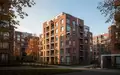 Mehrfamilienhäuser in einem Wohnquartier an einem sonnigen Herbsttag. - Foto: über boerse-global.de