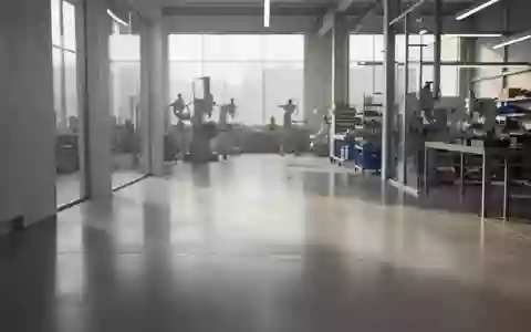Ein moderner, heller Industrieraum mit polierten Böden und minimalistischer Architektur in einer Produktionsumgebung. - Foto: über boerse-global.de