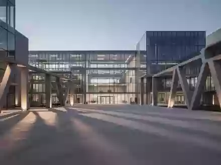 Moderne, minimalistische Forschungsarchitektur aus Glas und Stahl bei Dämmerung, die industrielle Stabilität und globale Regulierungsrahmen symbolisiert. - Foto: über boerse-global.de