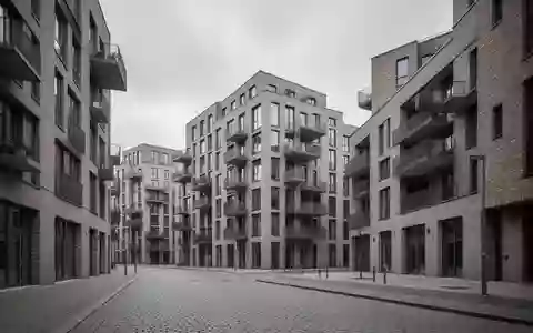 Moderne Wohngebäude in Hamburg vor einem bewölkten Himmel in einer ruhigen städtischen Umgebung. - Foto: über boerse-global.de