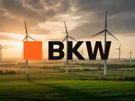 Moderne Windkraftanlagen in einer grünen Landschaft bei goldenem Licht als Symbol für erneuerbare Energien. - Foto: über boerse-global.de